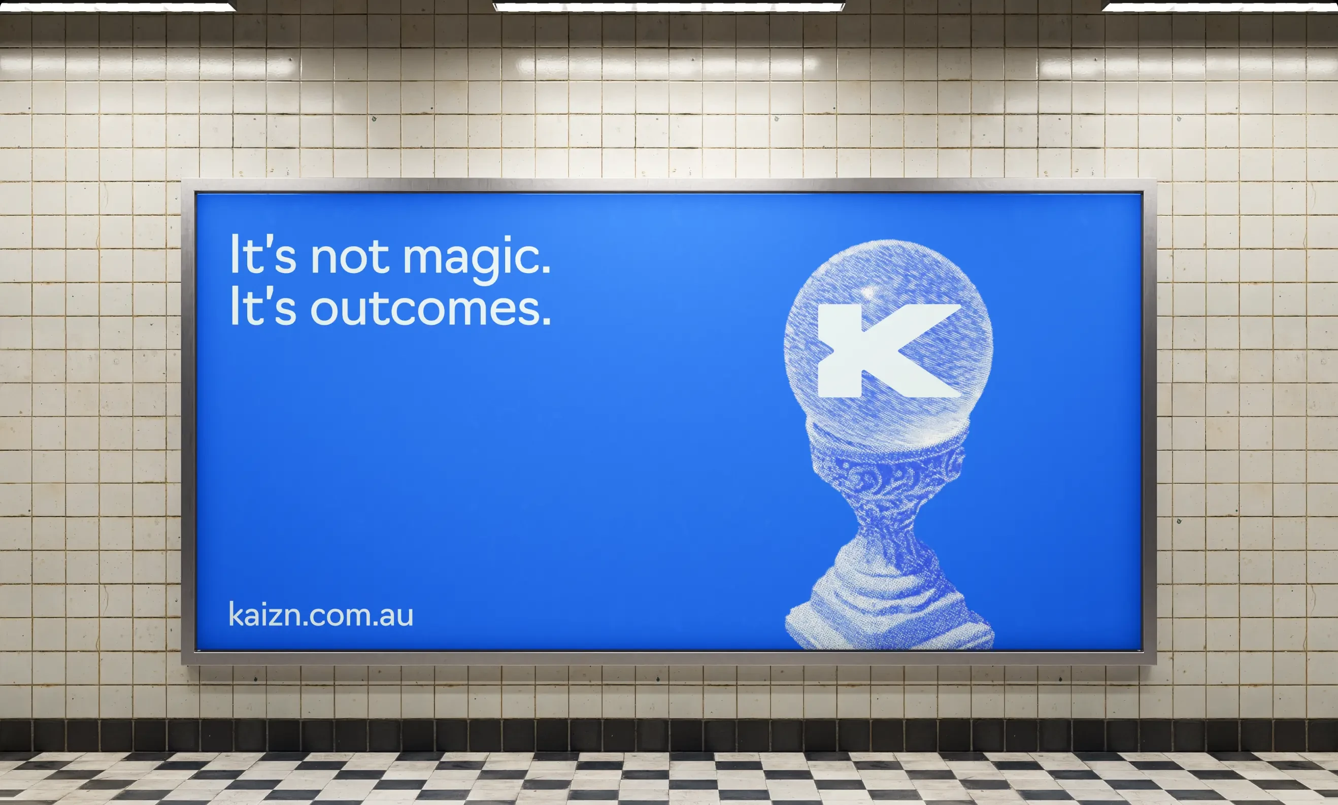 A lit station lightbox reading “It’s not magic. It’s outcomes.”