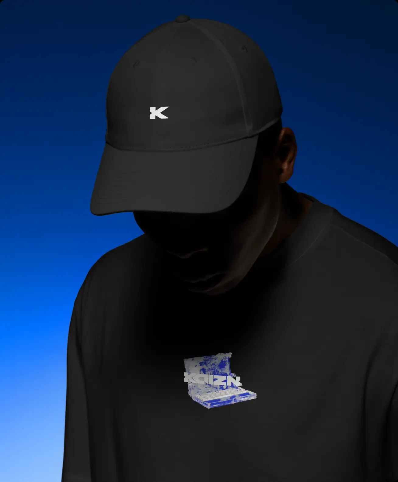 A black cap and hoodie carrying the mark, shot against the blue