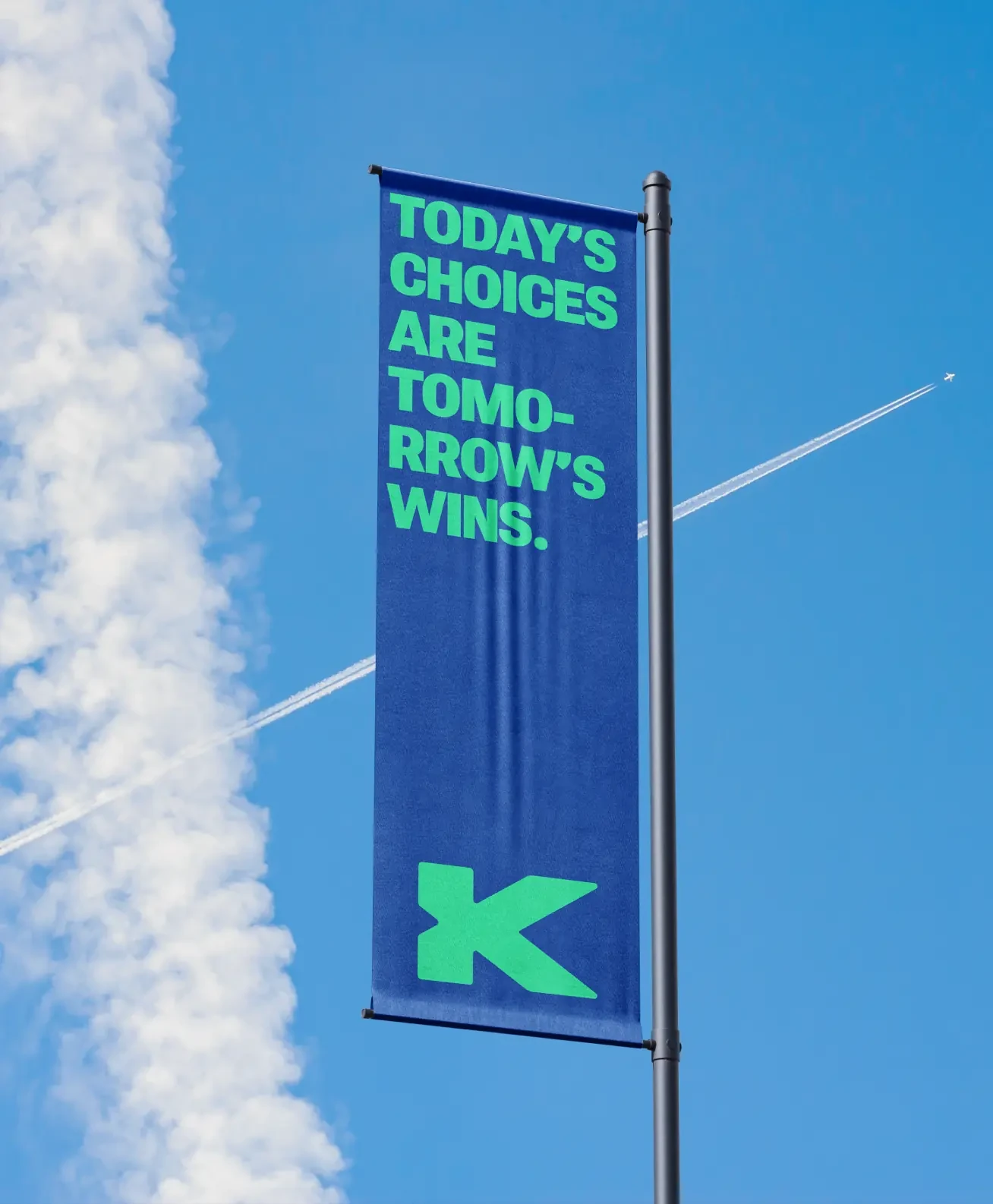 A street banner reading “Today’s choices are tomorrow’s wins”