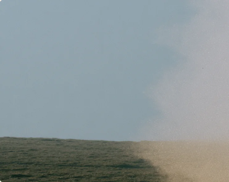 A flat horizon where sea meets haze