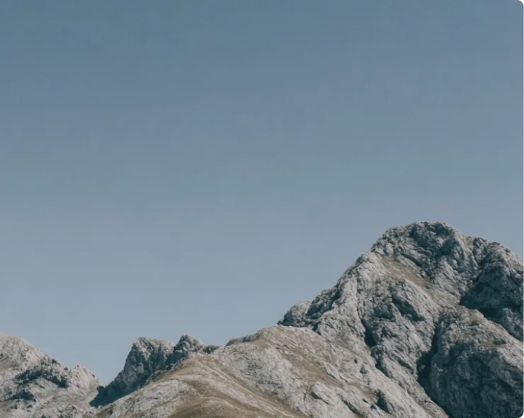A mountain range under an open sky