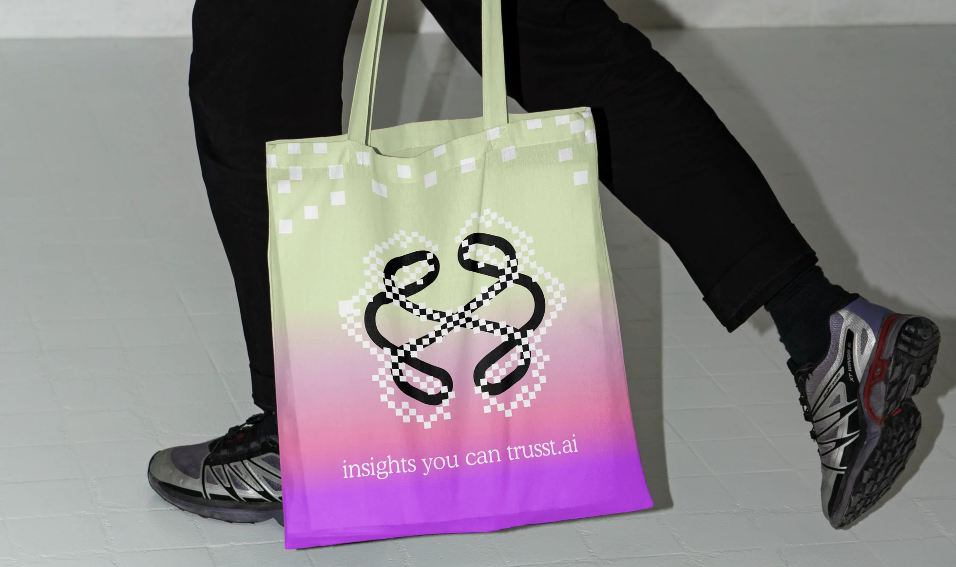 A honeydew-to-pink tote bag carried at street level