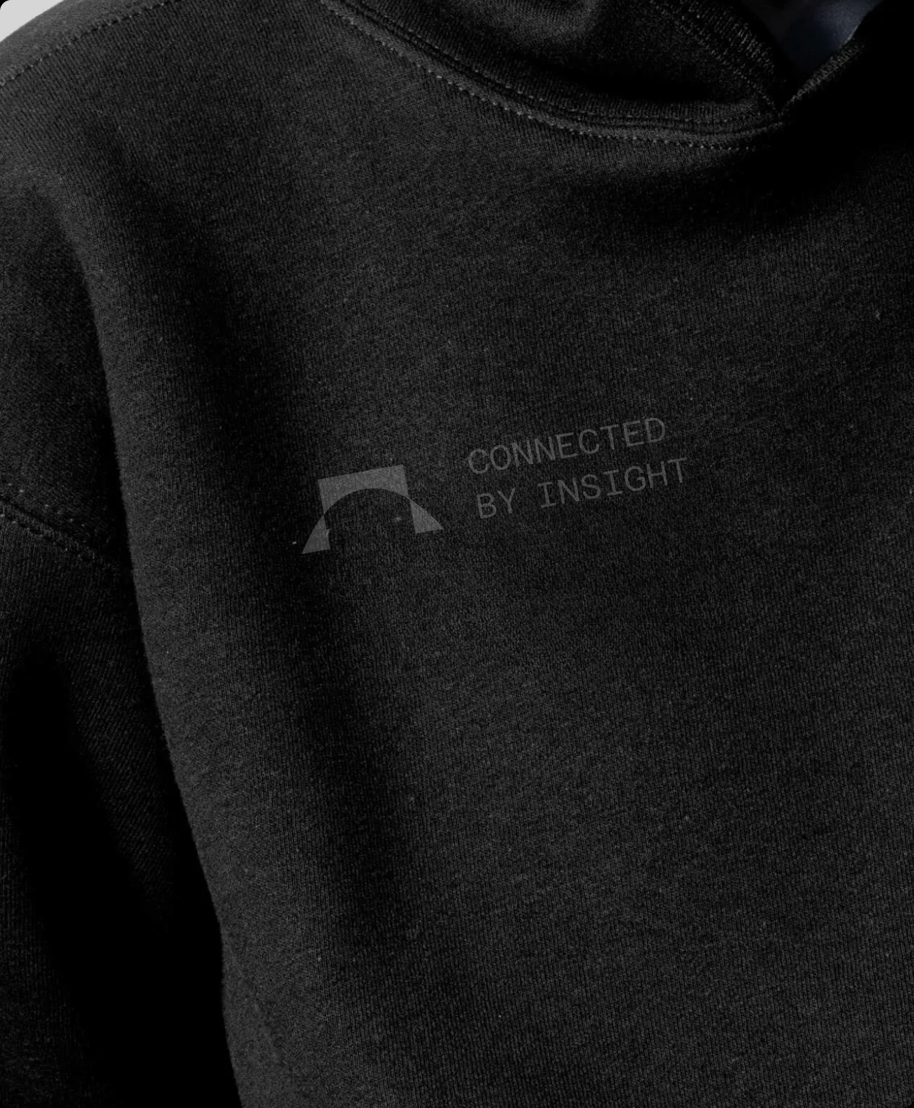 A black hoodie with the Mono AI mark embroidered across the chest